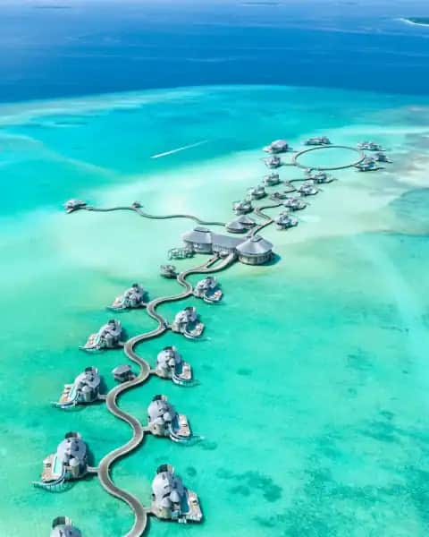 Maldives overwater villa and turquoise lagoon