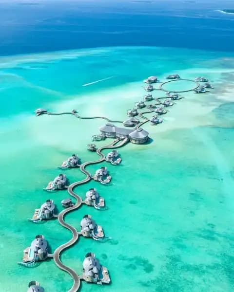 Maldives overwater villa and turquoise lagoon